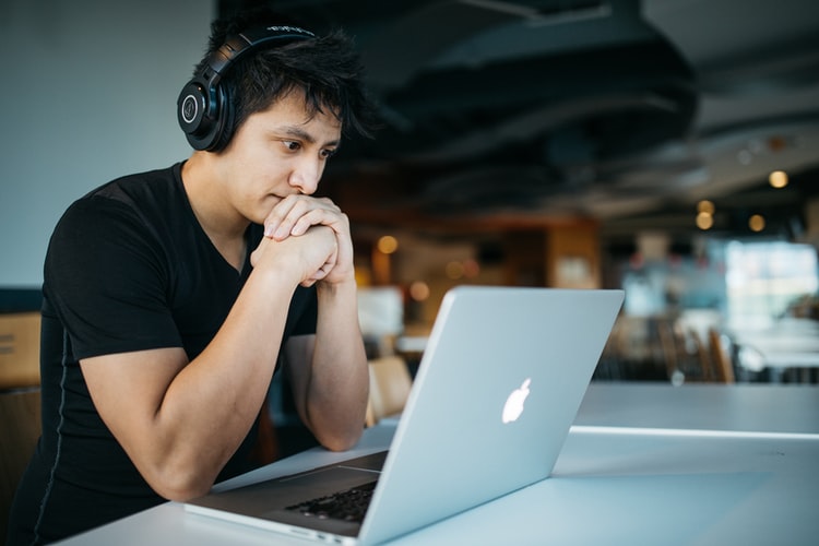 man looking at computer