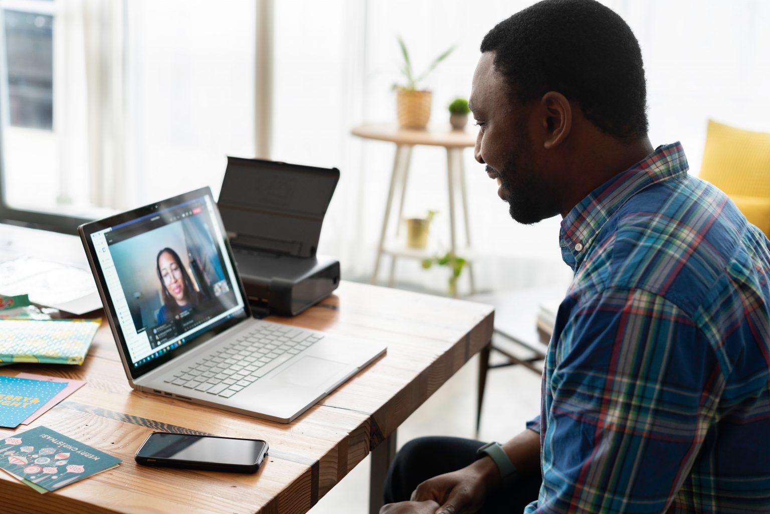 man smiling at computer