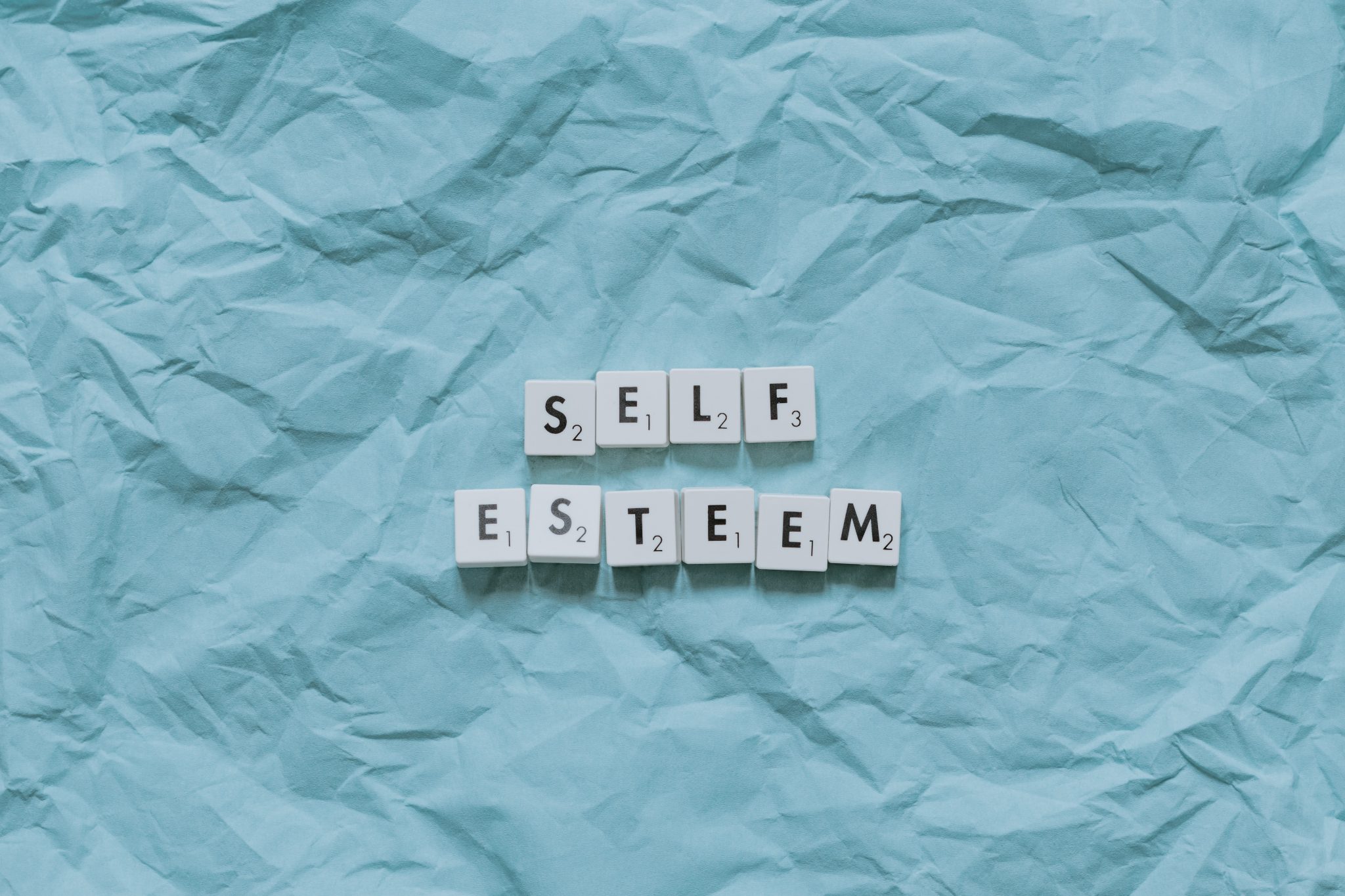 "self esteem" written in scrabble letters