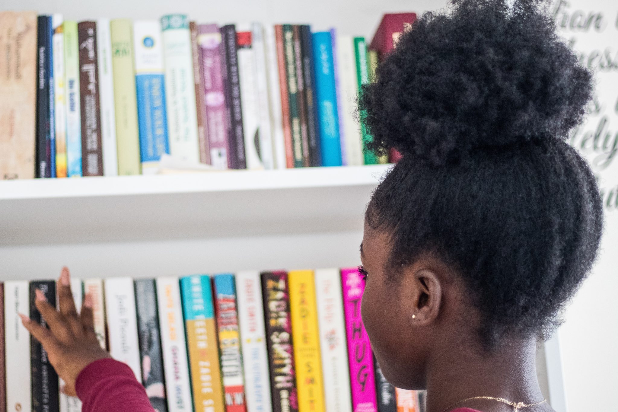 girl picking out a book