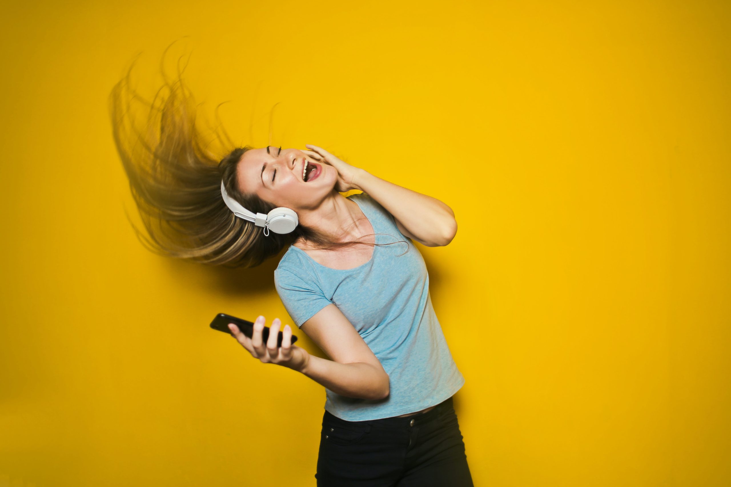 woman listening to music, singing