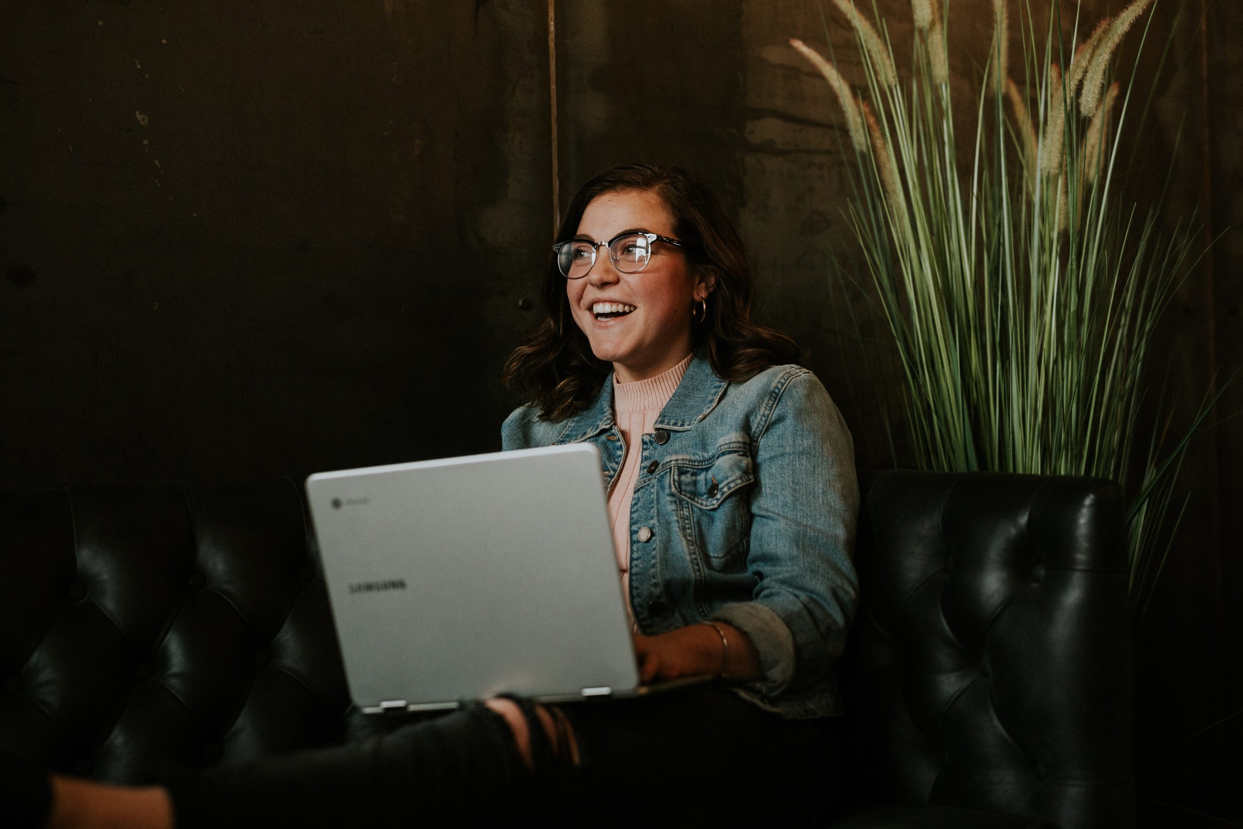 woman smiling with laptop