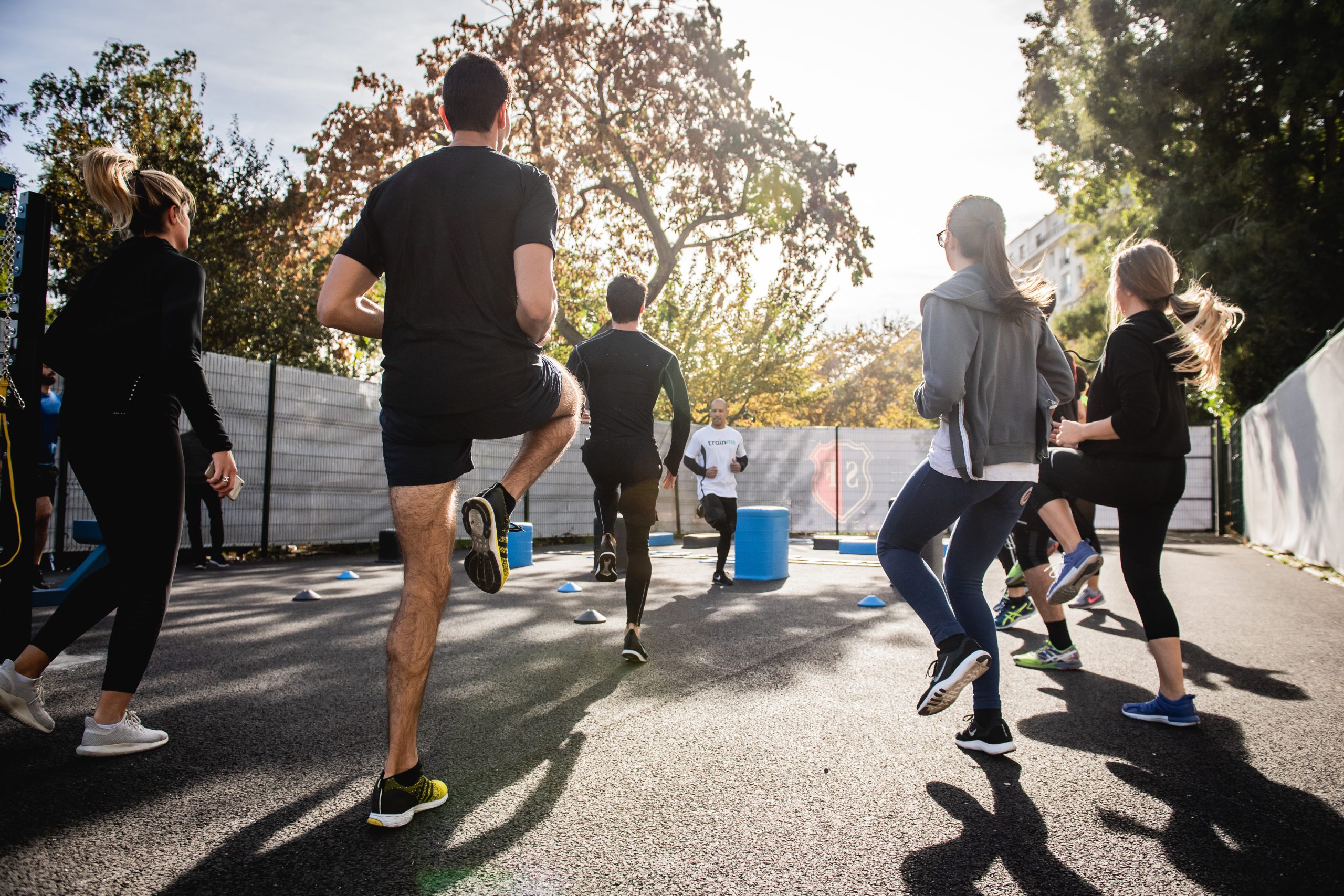 group of people doing a warm up before working out