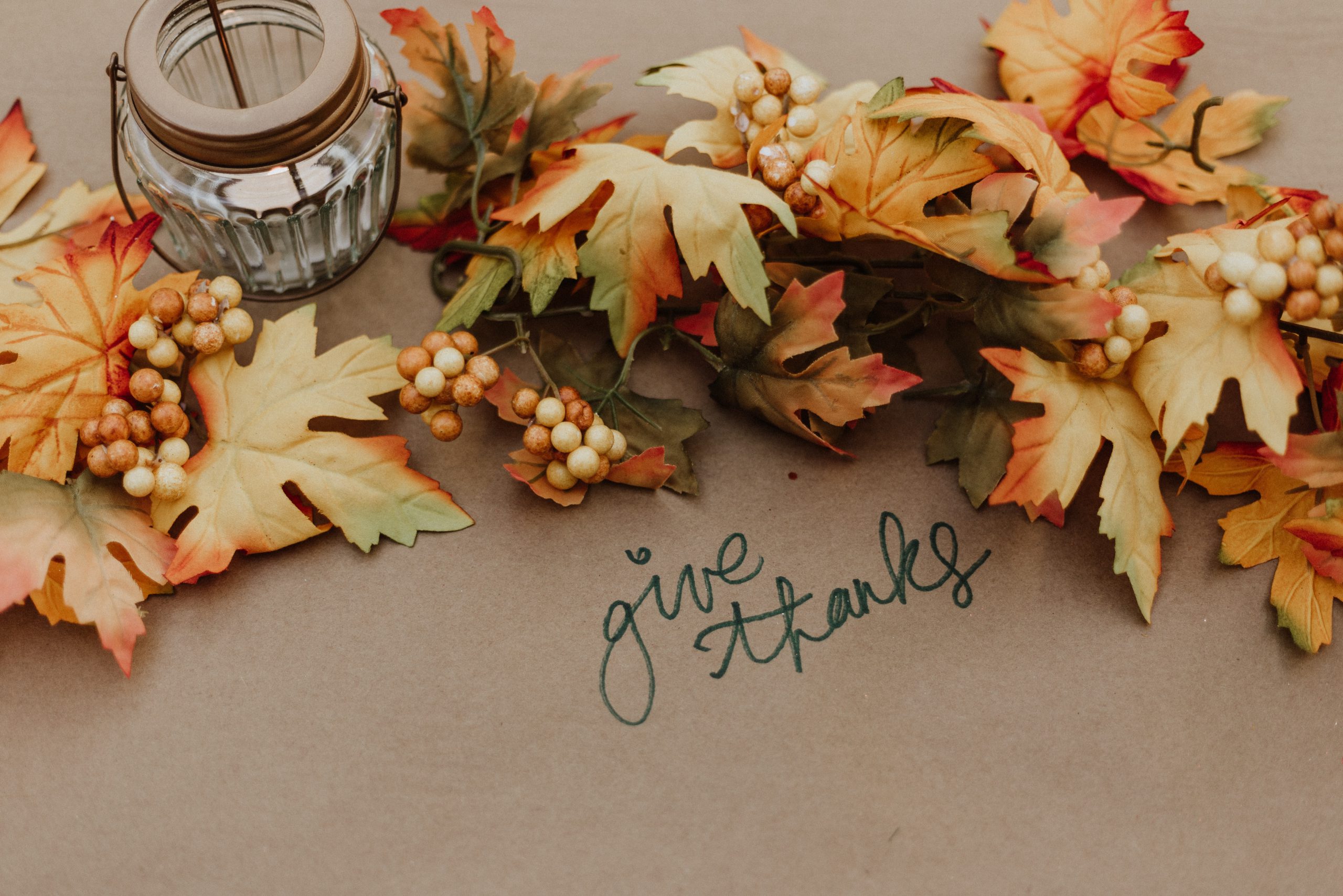 table with fall leaves and words 'give thanks'