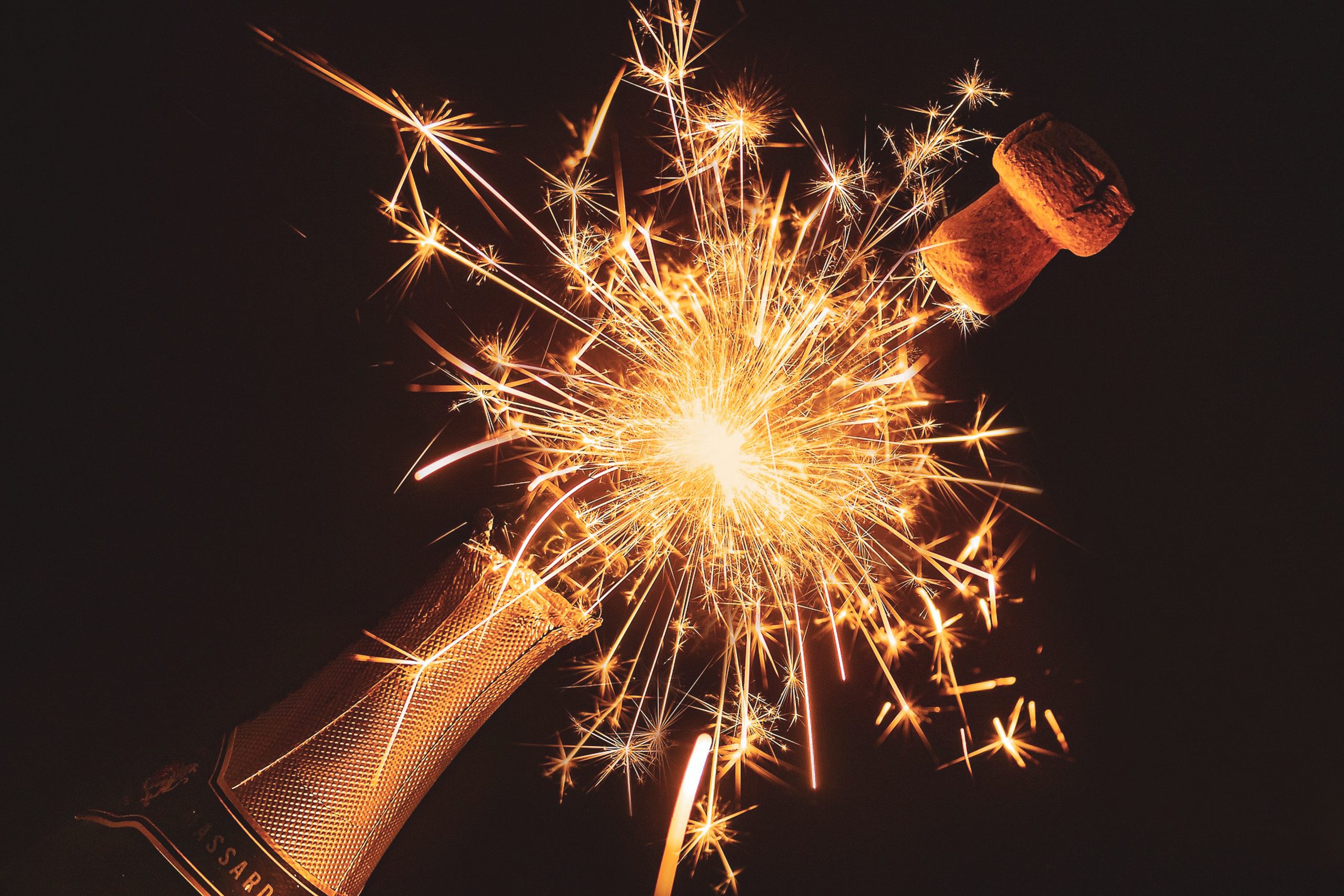 champagne bottle opening with fireworks